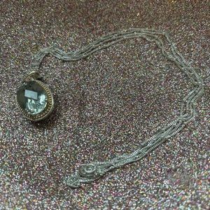 Sterling silver necklace with a very light green stone.